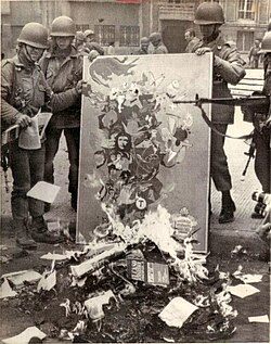 Burning of a painting containing Che's face, following the 1973 coup that installed the Pinochet regime in Chile