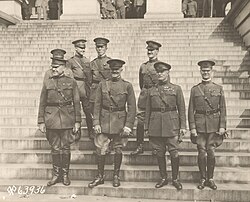 General of the Armies John J. Pershing and members of his staff standing outside the State, War, and Navy Building in Washington, D.C., 23 September 1919. Pershing is second from left in front row. Marshall is behind Pershing.