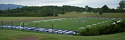 Youngman Field at Alumni Stadium, with the Ralph Myhre 18-hole golf course in the background