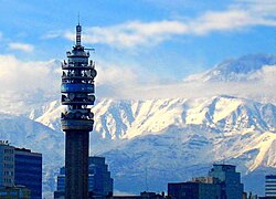 Torre Entel in Santiago de Chile, with the Andes Mountains in the background