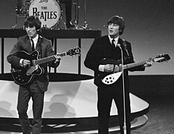 Spector influenced and helped facilitate the success of teen-oriented bands such as the Beatles. John Lennon (right) later stated, "Spector kept rock 'n' roll alive while Elvis was in the army".[136]