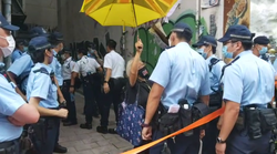 Alexandra Wong surrounded by police prior to her arrest