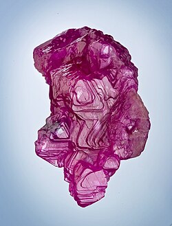 Large ruby (corundum) crystal from Mogok. Size: 5.5 × 3.2 × 3 cm.[260]