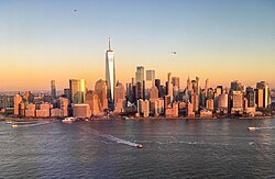 Ferries departing Battery Park City Ferry Terminal and helicopters flying above Manhattan