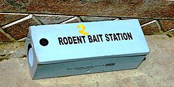 Blue box labeled "rodent bait station"