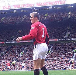 Neville in action at Old Trafford in March 2004