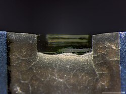 A diamond knife blade used for cutting ultrathin sections (typically 70 to 350 nm) for transmission electron microscopy
