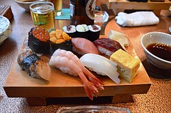 Sushi served on a wooden platter at a sushi restaurant in Kanagawa Prefecture, Japan