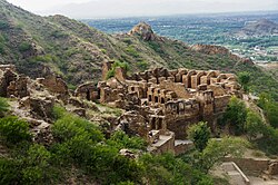 The nearby Takht-i-Bahi monastery was established in 46 CE,[50] and was once a major centre of Buddhist learning.