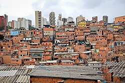 Paraisópolis, the largest slum (favela) in the city, with residential buildings in the background