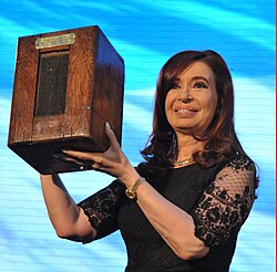 President Cristina Fernández de Kirchner with a century old ballot box in commemoration of the centenary of the passing of the Sáenz Peña Law.