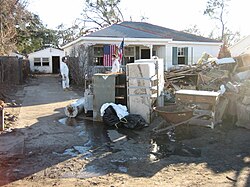 Clearing out trashed possessions and gutting flood damaged home, Gentilly neighborhood, January 2006.