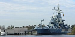 The USS North Carolina Battleship Memorial, seen from downtown Wilmington, across the Cape Fear River