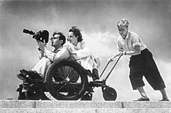 Leni Riefenstahl (behind cameraman) at the 1936 Summer Olympics