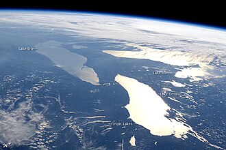 Photograph of, closest to farthest, Lakes Ontario, Erie and Huron (North is to the right) plus the Finger Lakes of upstate New York, near Lake Ontario, June 14, 2012, taken aboard the International Space Station, with lake names added