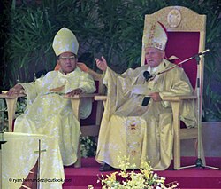 Pope John Paul II (right) with Cardinal Jaime Sin, Archbishop of Manila (left), addressing the crowd attending the closing Mass of the tenth World Youth Day at Luneta Park, 1995