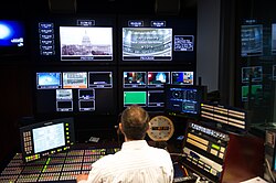 An employee of the House Recording Studio prepares for a video shoot by a House Member.
