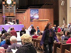 An Evangelical-Lutheran pastor distributes ashes during the celebration of Mass (Divine Service) on Ash Wednesday.