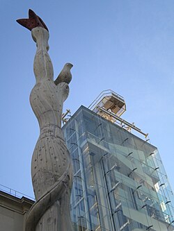 The Museo Nacional Centro de Arte Reina Sofía (MNCARS) is Spain's national museum of 20th-century art, located in Madrid. The photo shows the old building with the addition of one of the contemporary glass towers to the exterior by Ian Ritchie Architects with a closeup of the modern art tower.