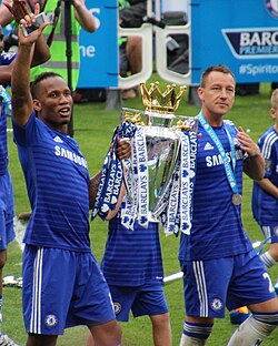 Drogba and John Terry holding the Premier League trophy in May 2015