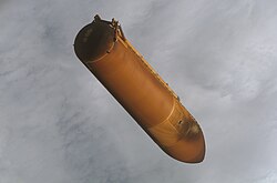The ET from STS-115 after separation from the orbiter. The scorch mark near the front end of the tank is from the SRB separation motors.