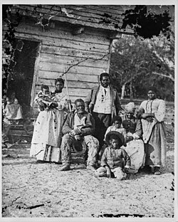 Four generations of a formerly enslaved family, photographed by Timothy H. O'Sullivan on J. J. Smith's confiscated plantation at Beaufort, South Carolina (now U.S. Naval Hospital Beaufort) during the Port Royal Experiment, 1862