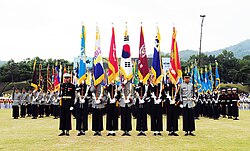 Joint colour guard showing the organizational colours of each branch (L-R): Air Force, Army, Armed Forces, National, Joint Chiefs of Staff, Navy and Marine Corps.