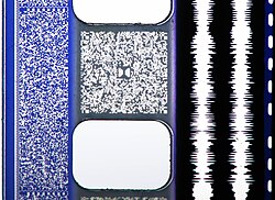 A photo of a 35 mm film print featuring all four audio formats (or "quad track") — from left to right: SDDS, a soundtrack as an image of a digital signal (blue area to the left of the sprocket holes); Dolby Digital sound (grey area between the sprocket holes labelled with the Dolby "Double-D" logo in the middle); analog optical sound, optically recorded as waveforms containing the audio signals for the left and right audio channels (the two white lines to the right of the sprocket holes); and the DTS time code (the dashed line to the far right).