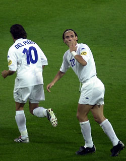 Totti (right) celebrates alongside teammate Alessandro Del Piero at Euro 2000. Totti's performances through the tournament earned him the number 10 shirt of Italy.