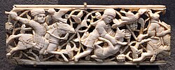 Arabesque pattern behind hunters on ivory plaque, 11th–12th century, Egypt