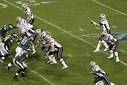 The Patriots playing against the Eagles in Super Bowl XXXIX