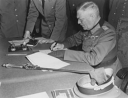 Keitel signs surrender terms, 8 May 1945 in Berlin.