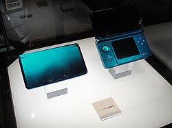 A prototype Aqua Blue Nintendo 3DS shown at E3 2010; the circle pad was originally colored alongside the console.