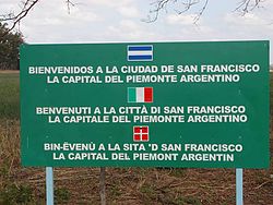 Trilingual sign in Spanish, Italian and Piedmontese in San Francisco, Córdoba Province, Argentina.
