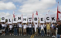 A group of protesters hold signs praising Beck at the Taxpayer March on Washington.
