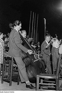A German double bass section in 1952. The player to the left is using a German bow.