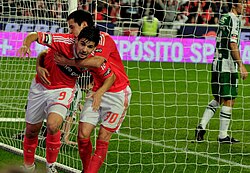Nolito celebrates scoring a goal by running from teammates.