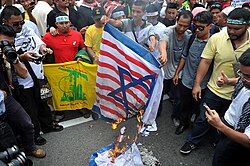 Protesters in Kuala Lumpur, Malaysia, with a Hezbollah flag in September 2012