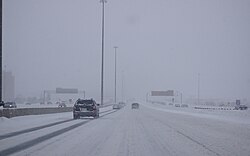 Reduced visibility on Ontario Highway 401 in Toronto due to a snowsquall.
