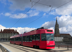 Tram on the Kirchenfeldbrücke, with the Bern Minster and Casino Bern in the background
