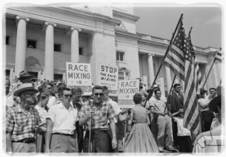 Segregationists protesting the integration of Central High School at the state capitol, 1959