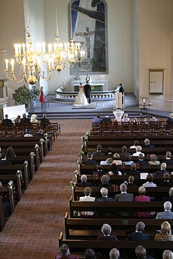 Wedding ceremony inside the Kiuruvesi Church in Kiuruvesi, Finland