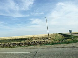 Wheatfield intersection in the Southern Saskatchewan prairies, Canada