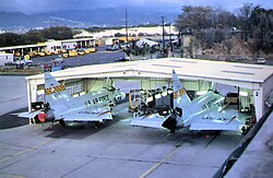 Hawaii ANG 199th Fighter Interceptor Squadron F-102s in maintenance hangar at Hickam, 1976 Convair F-102A-30-CO Delta Dagger 54-1373 identifiable, aircraft now on static display at Hickam.