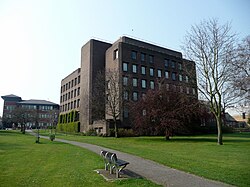 a six-storey building with a dark-brown brick veneer.