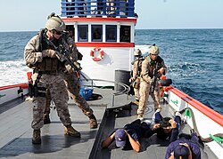U.S. Marines Fleet Anti-terrorism Security Team conducting an exercise aboard a fishing vessel