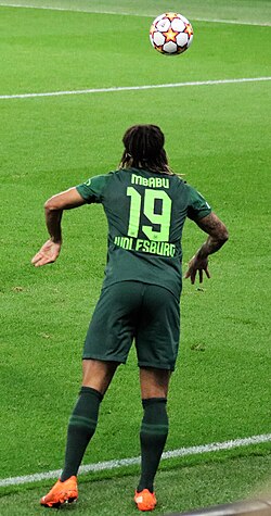 Mbabu in action with VfL Wolfsburg in 2021