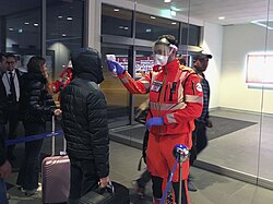 Civil Protection volunteers carrying out health checks at the Guglielmo Marconi Airport in Bologna, Italy
