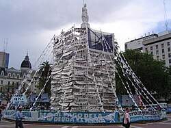 Pirámide de Mayo covered with photos of the desaparecidos by the Mothers of the Plaza de Mayo in 2004