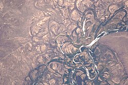 Meander scars, oxbow lakes and abandoned meanders in the broad flood plain of the Rio Negro, Argentina. 2010 photo from ISS.